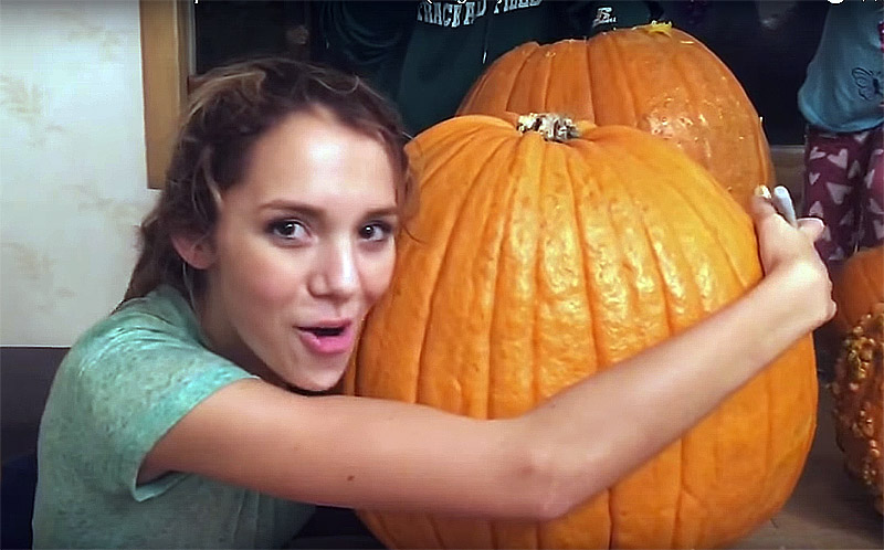 Teen gets her head stuck inside a giant pumpkin! 